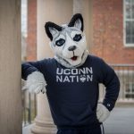 Jonathan Husky Mascot in navy blue UConn Nation Shirt