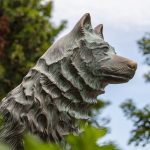 Jonathan the dog statue surrounded by greenery