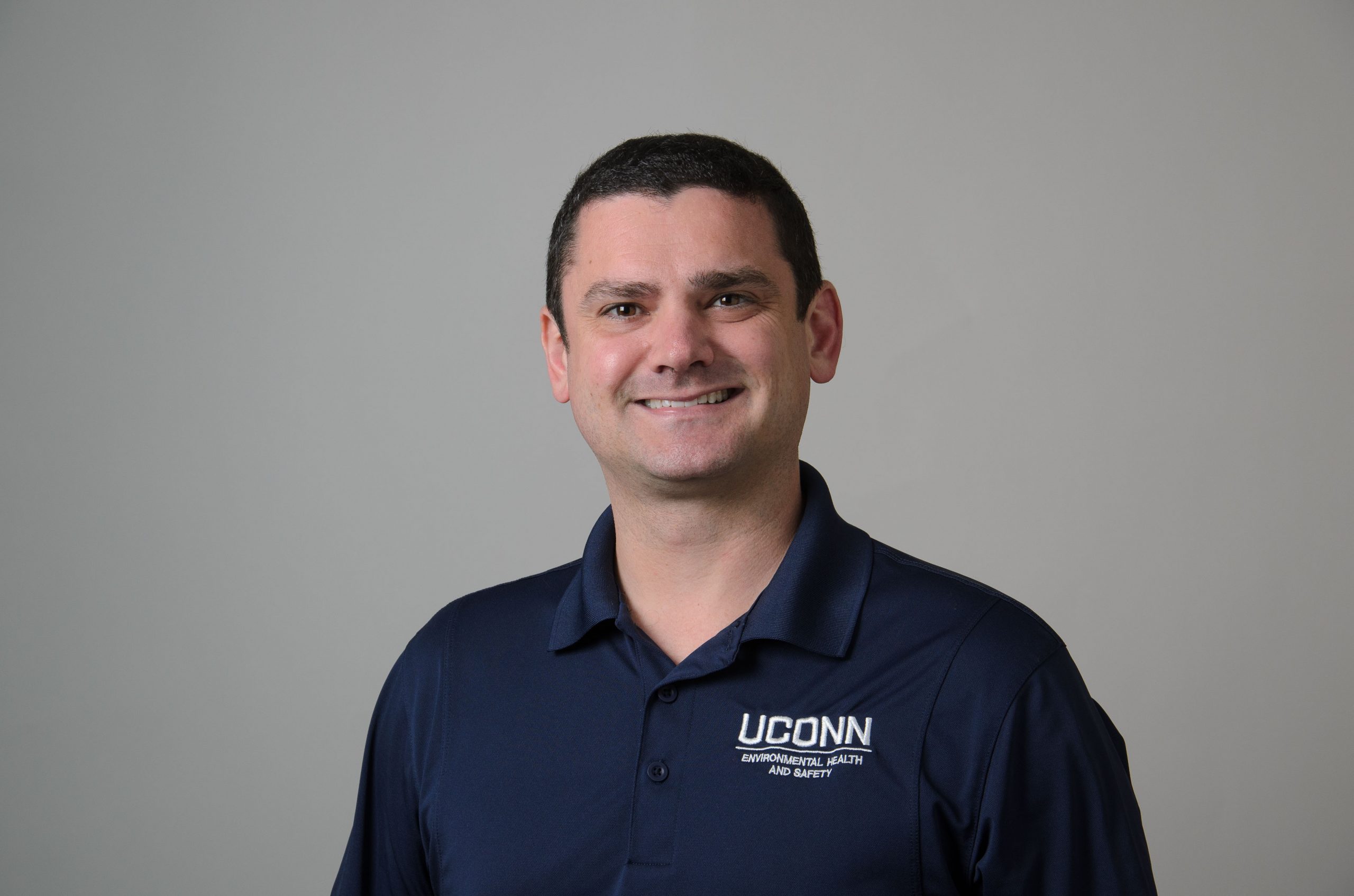 Headshot of James Blum. Navy Blue UConn Shirt
